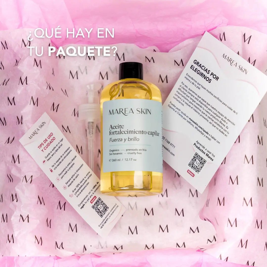 Aceite de fortalecimiento capilar en su caja y con los complementos que incluye la compra